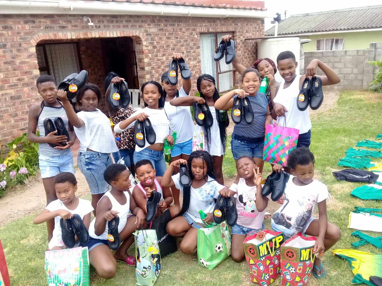 Kariega Boma Dancers receive a donation of school shoes.JPG
