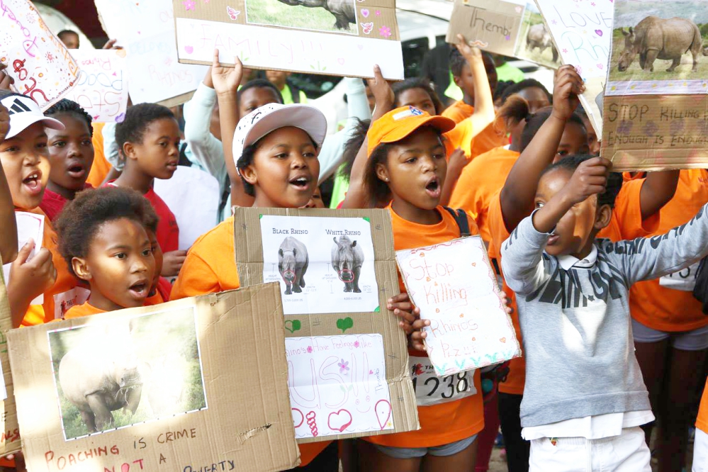 Kariega community sports teams singing to save our rhino