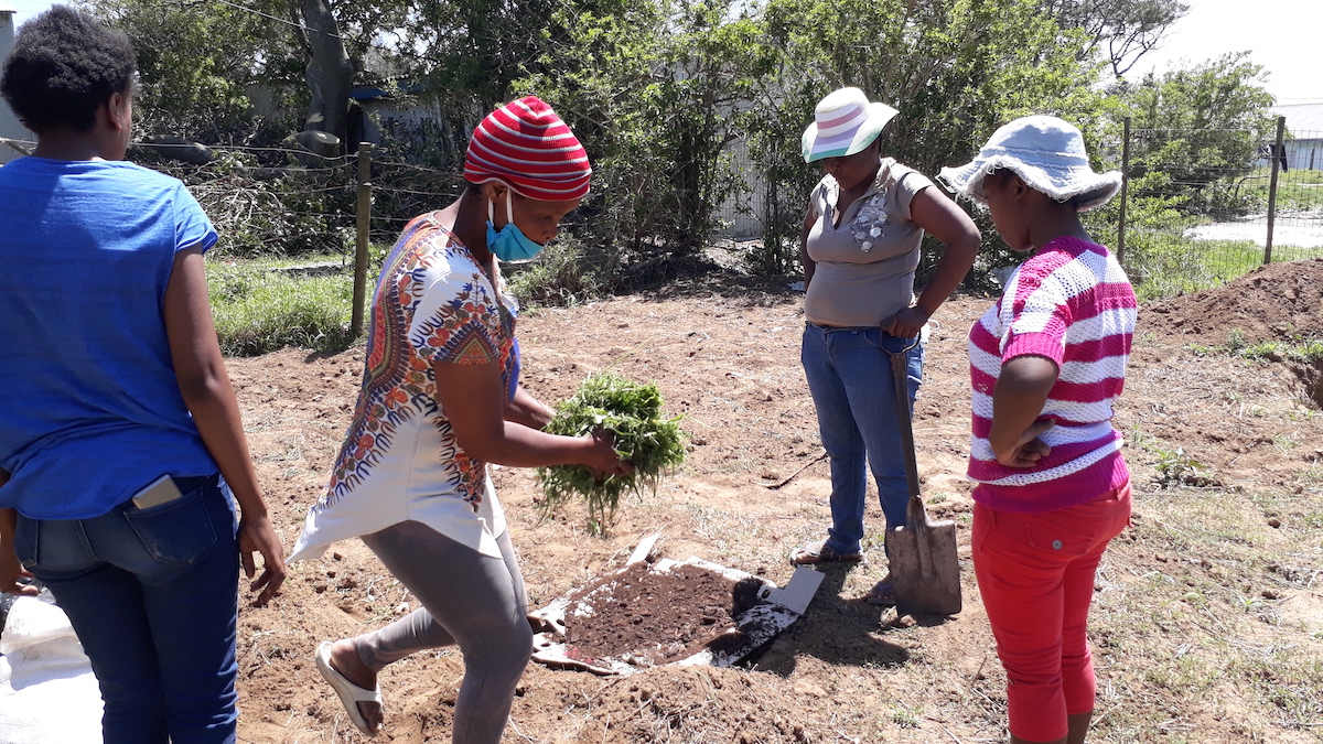 Community mothers group preparing their garden