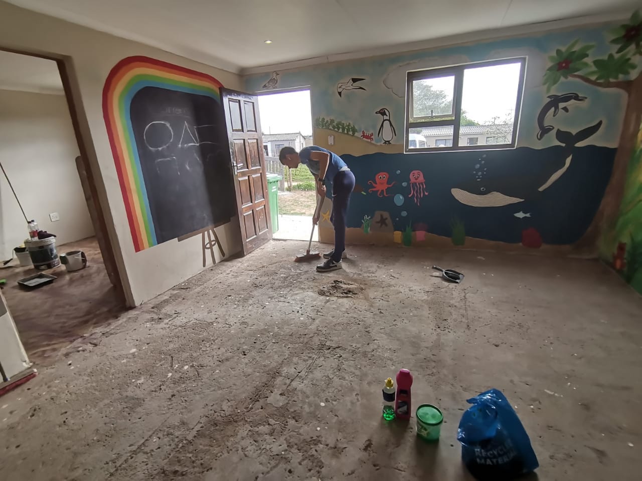 Rainbow Day Care murals and new floor in progress