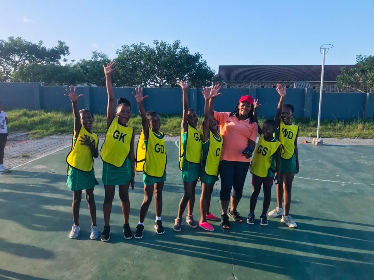 Kariega Foundation netball players high-five our donors