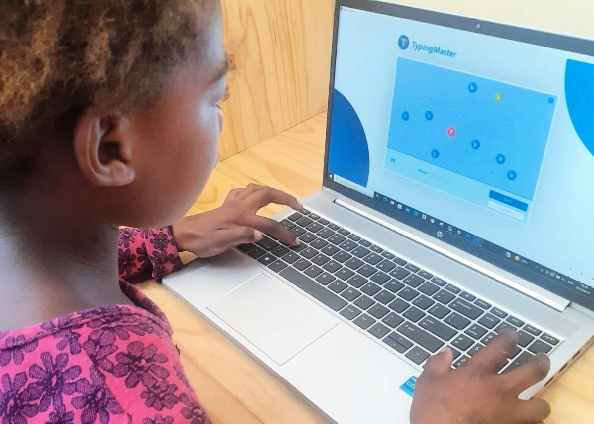 A young learner using the computers